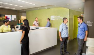 Dentist, patients and staff in lobby