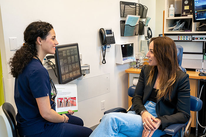 Dentists explaining dental implants option to a patient