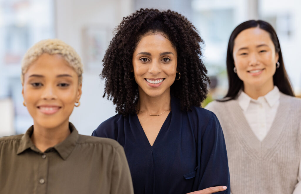 Confident, diverse group of professional women smiling brightly