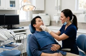 Dentist caring for a patient after a tooth extraction at a Toronto dental office